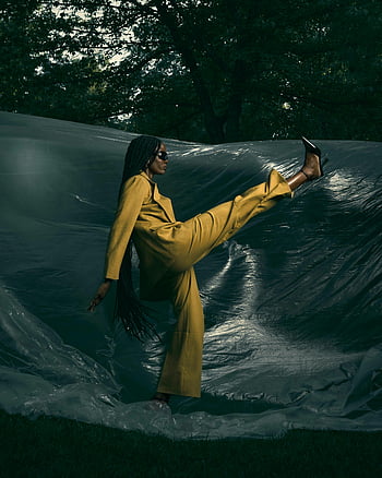 black woman fashionable woman mustard suit confident stride outdoor style elegance black tarp outdoor fashion stylish pose confident pose thumbnail